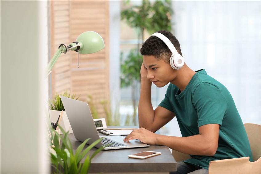 teenage boy using computer