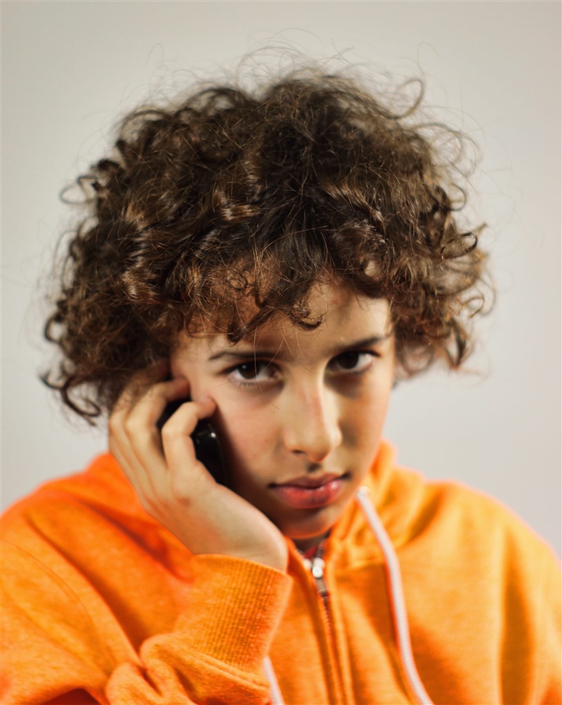 teen with cell phone